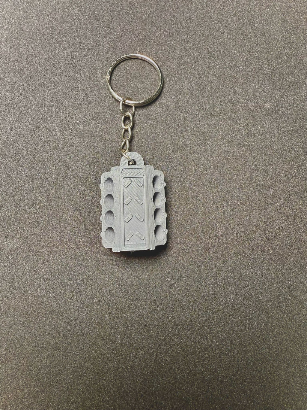 Schlüsselanhänger Motorblock