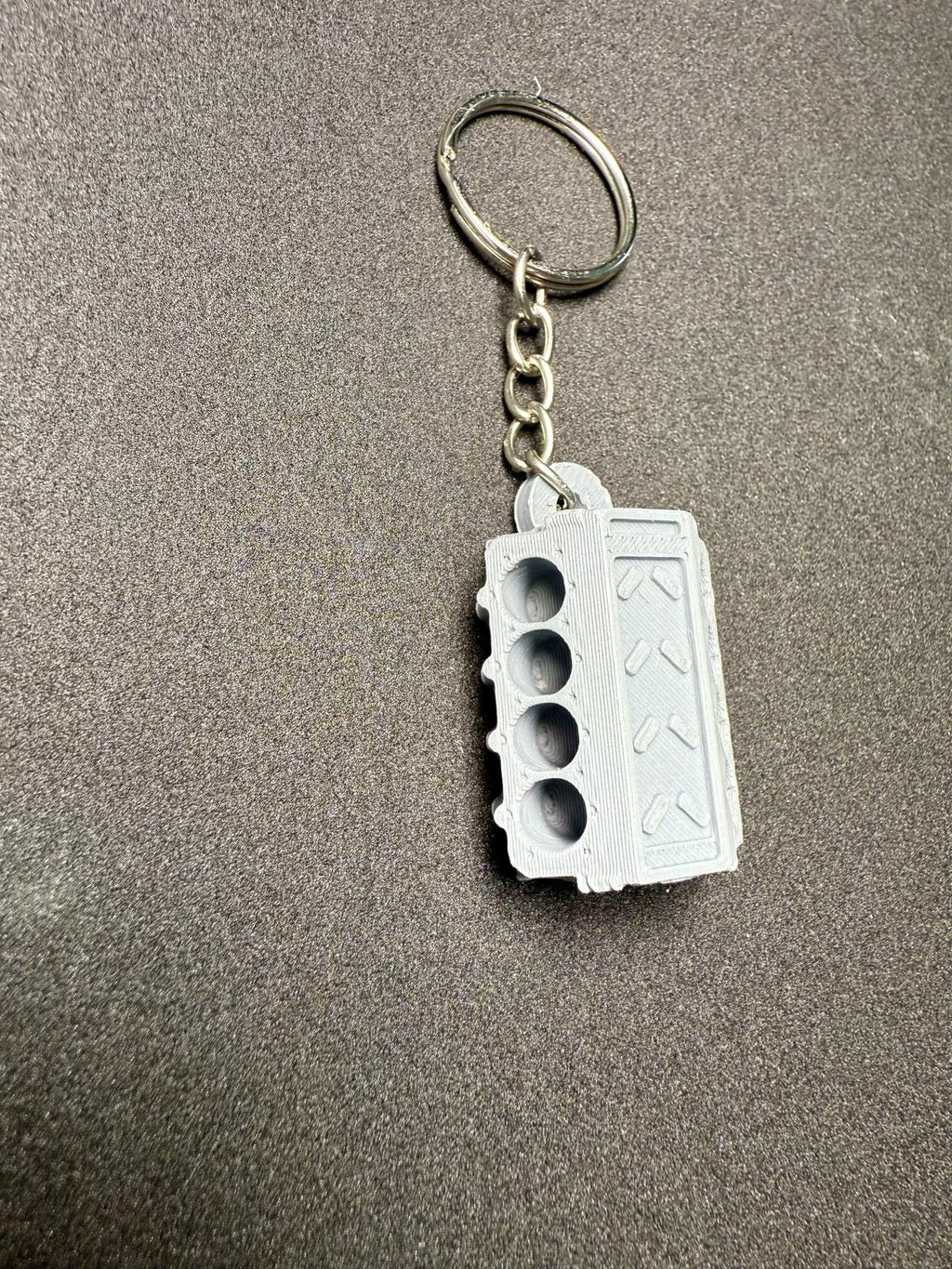 Schlüsselanhänger Motorblock