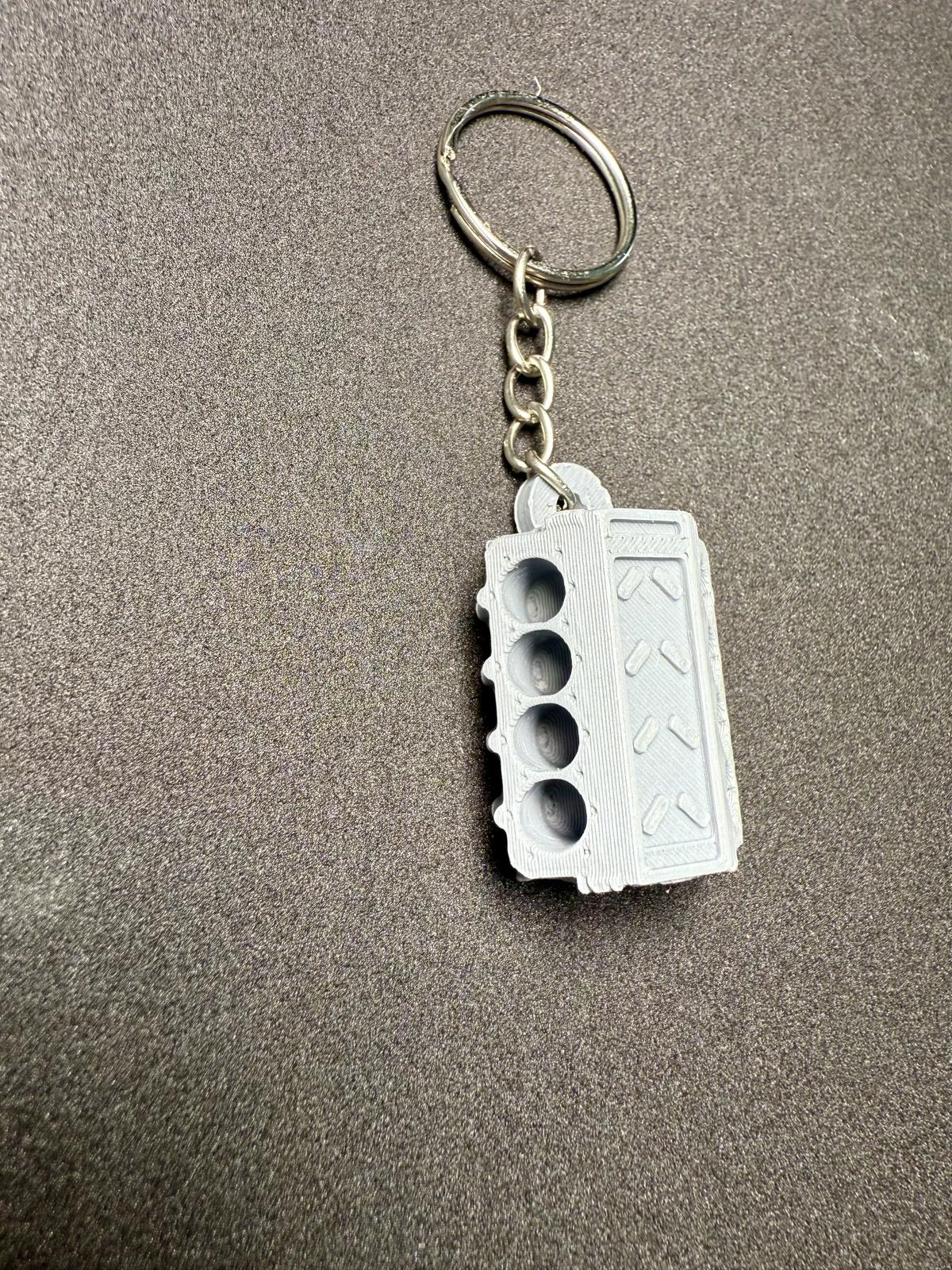 Schlüsselanhänger Motorblock